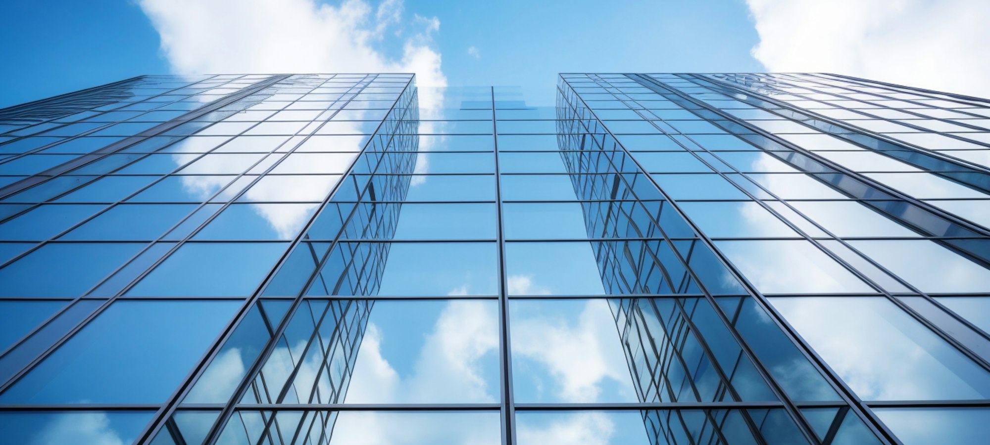Glass office towers seen from below